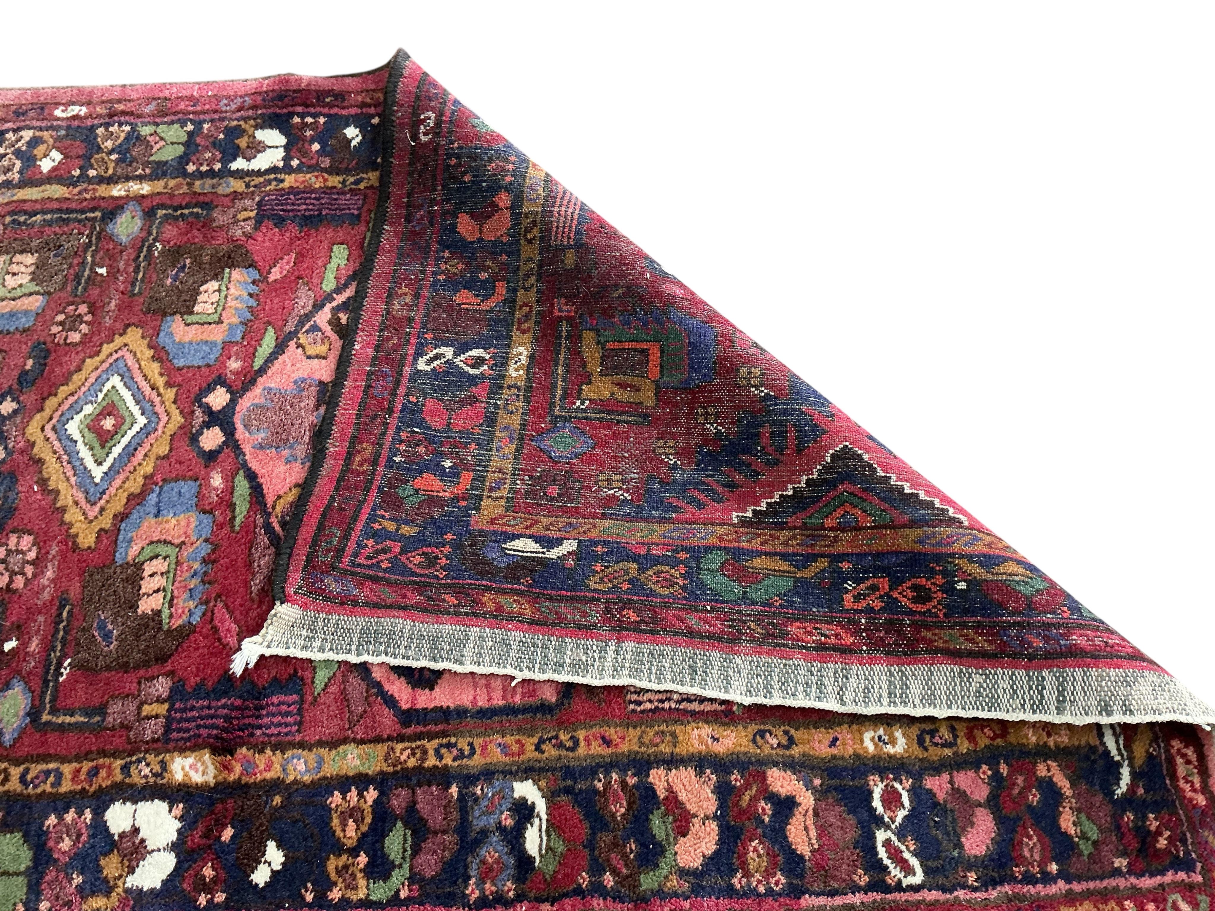 A Karabagh red ground rug, 200 x 112cm